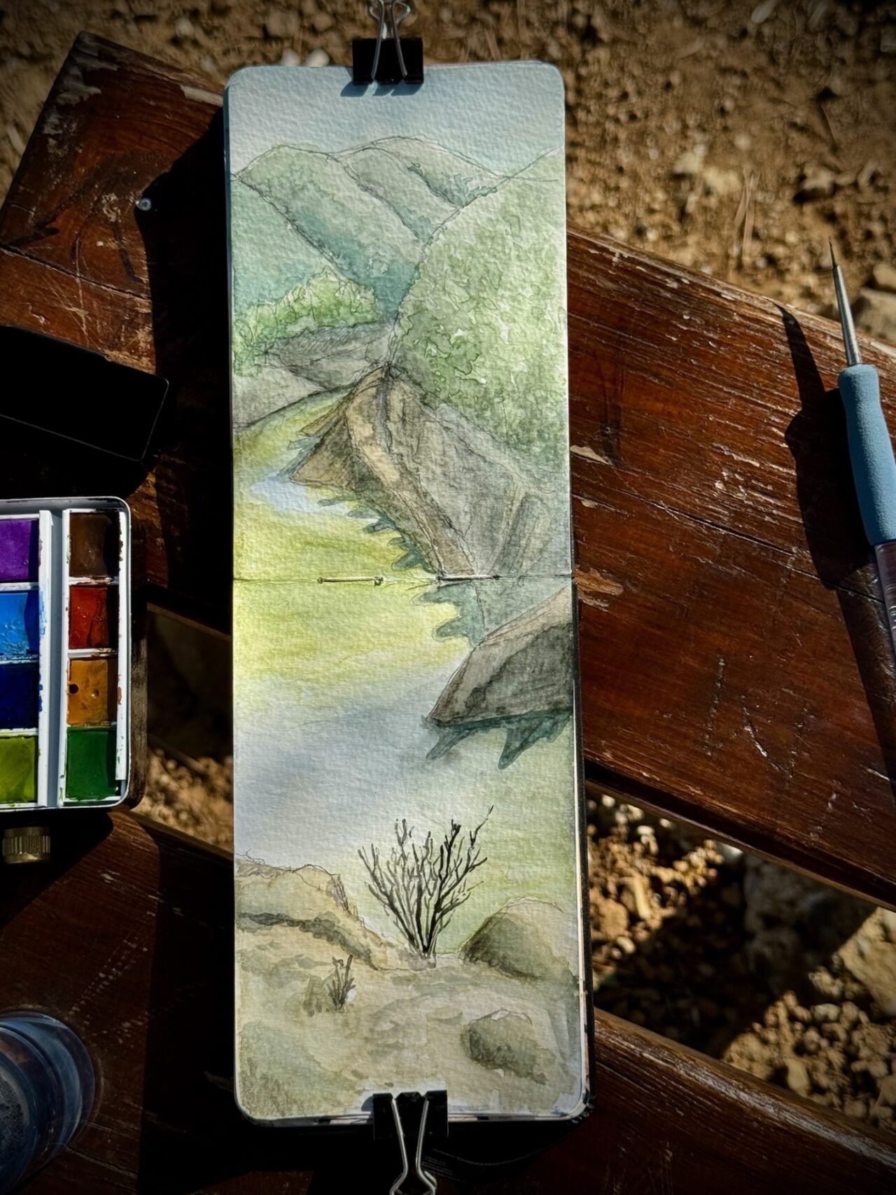 A watercolor plein-air painting of Xyliatos dam in Cyprus